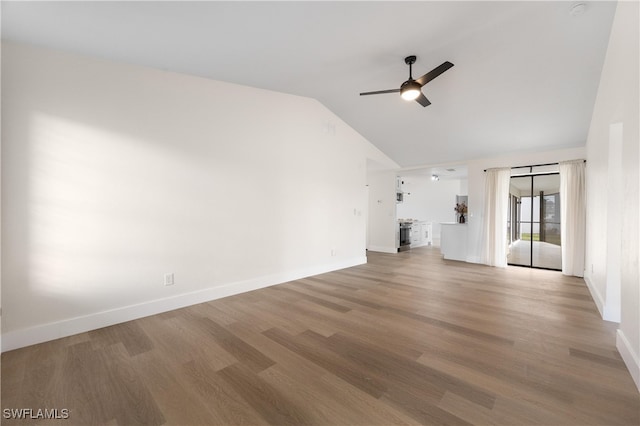 unfurnished living room featuring ceiling fan, vaulted ceiling, and hardwood / wood-style floors