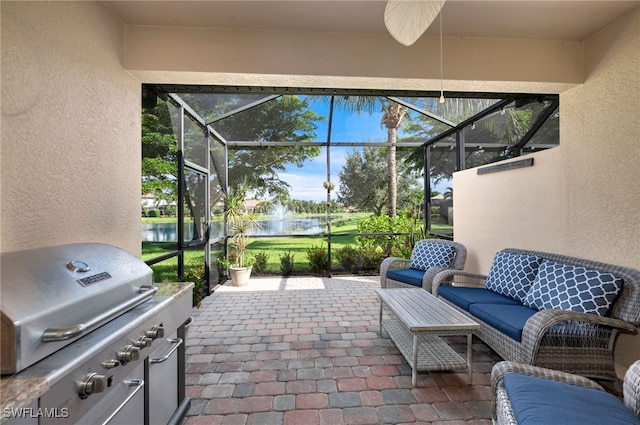 sunroom with a water view and a wealth of natural light