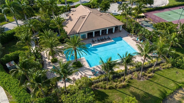 view of pool featuring a patio and tennis court