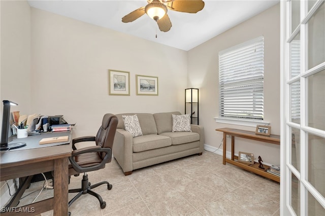 home office with light tile patterned flooring and ceiling fan