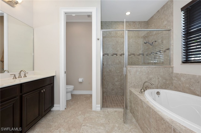 full bathroom featuring tile patterned flooring, vanity, separate shower and tub, and toilet