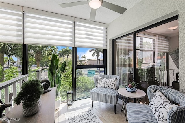 sunroom / solarium featuring ceiling fan