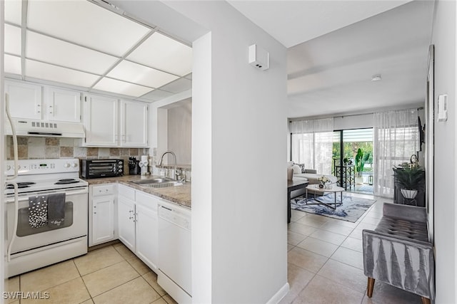 kitchen with white cabinets, light tile patterned floors, sink, white appliances, and extractor fan