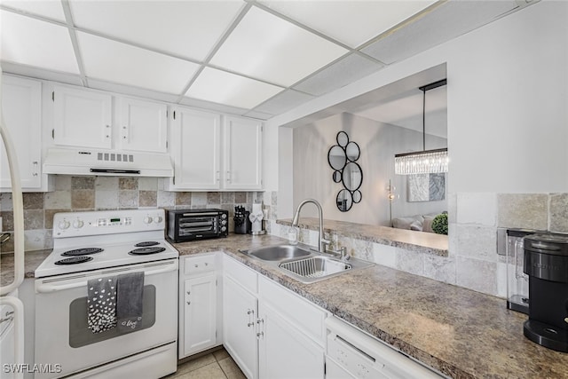 kitchen featuring a paneled ceiling, ventilation hood, white appliances, and white cabinetry