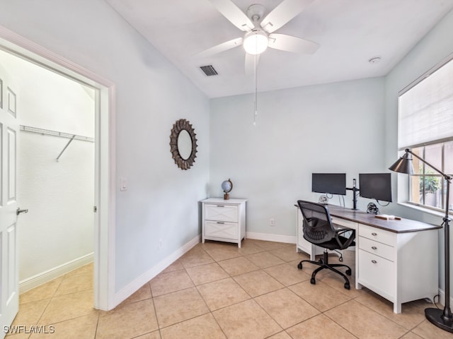 tiled office space with ceiling fan