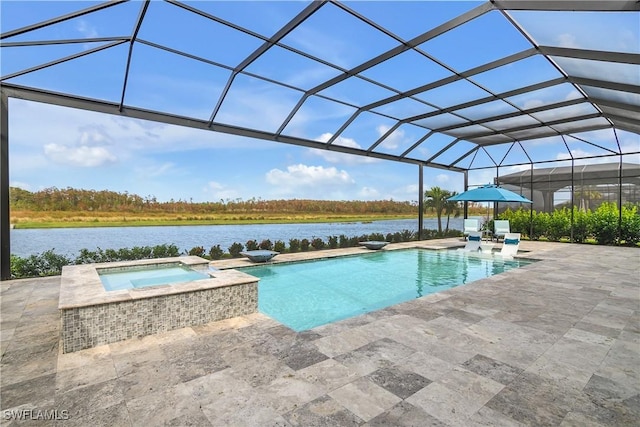 view of pool featuring glass enclosure, a water view, an in ground hot tub, and a patio