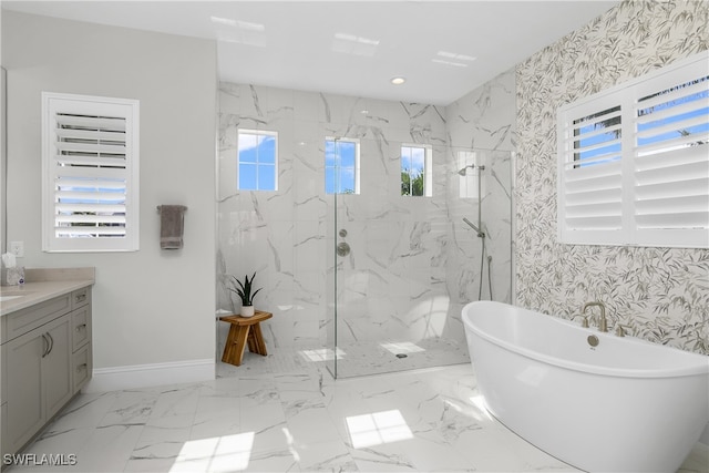 bathroom featuring vanity, separate shower and tub, and plenty of natural light