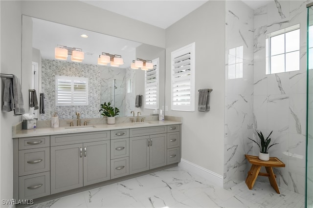 bathroom with vanity, a healthy amount of sunlight, and a tile shower