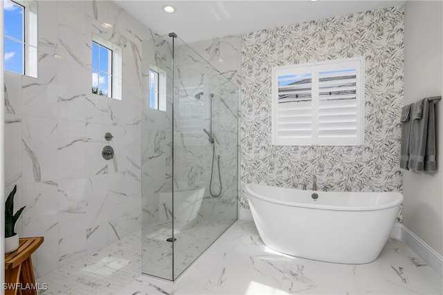 bathroom featuring separate shower and tub