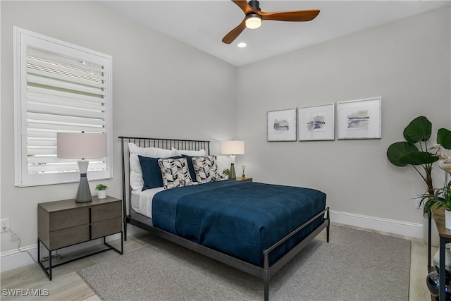 bedroom featuring ceiling fan and light hardwood / wood-style flooring