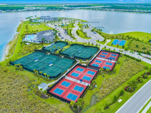 birds eye view of property with a water view