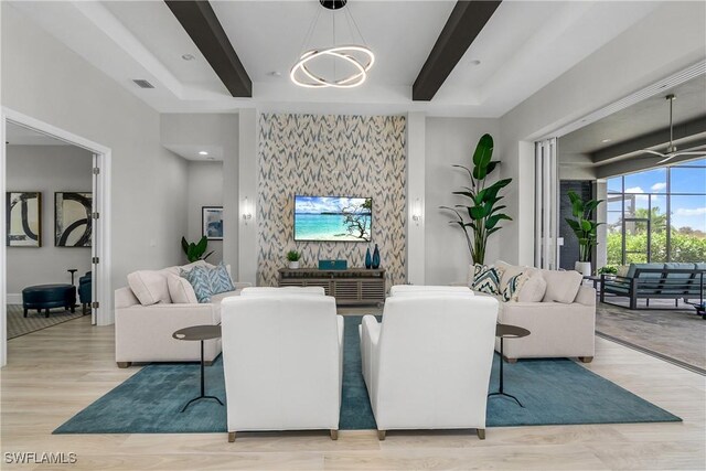 living room featuring light hardwood / wood-style flooring and a chandelier