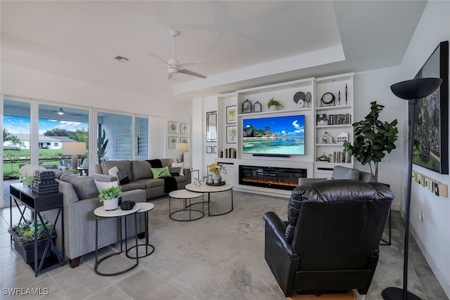 tiled living room with ceiling fan