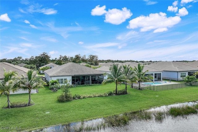 exterior space with a yard and a water view