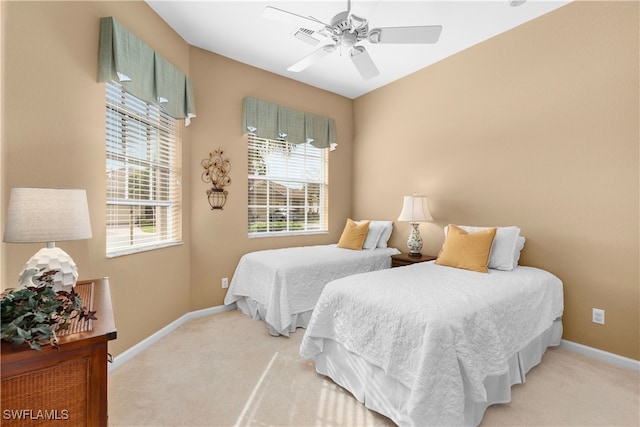 bedroom with light colored carpet and ceiling fan