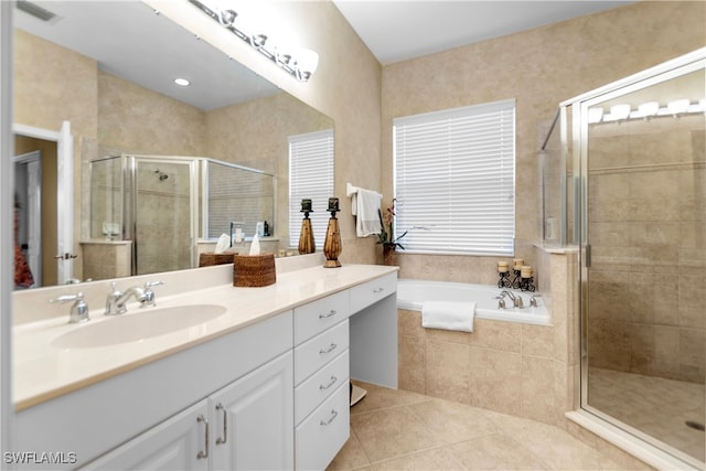 bathroom with tile patterned flooring, separate shower and tub, and vanity