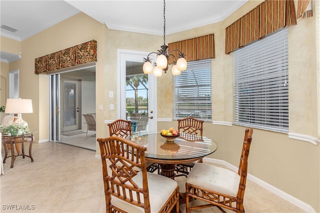 dining room featuring ornamental molding, light tile patterned flooring, and a chandelier