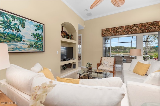 living room with ornamental molding and built in features