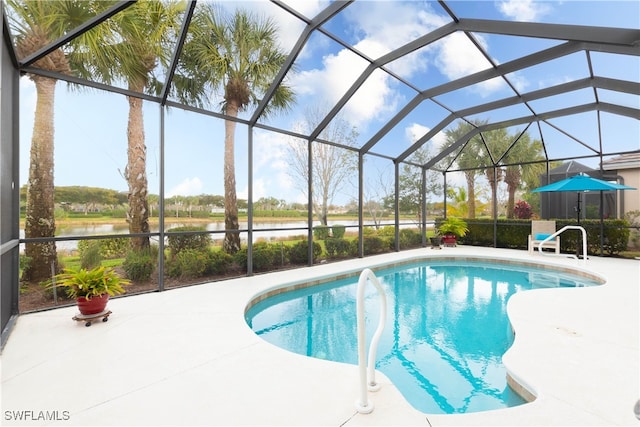 view of pool featuring a lanai, a patio, and a water view