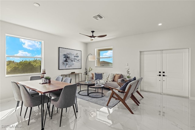 interior space with ceiling fan