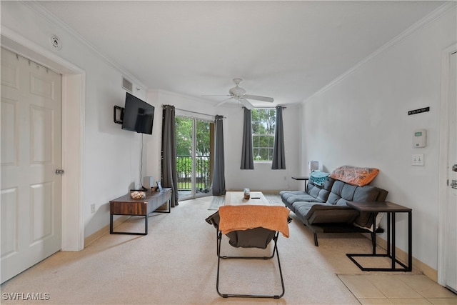 carpeted living room featuring ceiling fan and crown molding