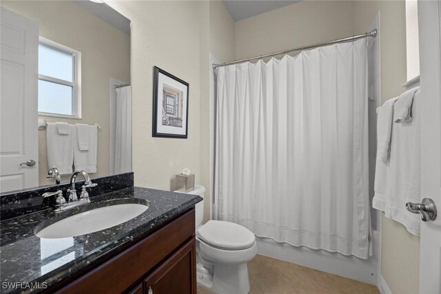 full bathroom with shower / bath combination with curtain, vanity, toilet, and tile patterned floors