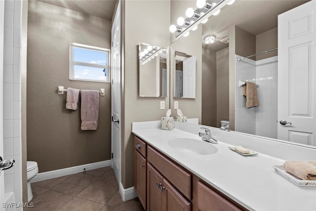 bathroom with tile patterned floors, vanity, and toilet