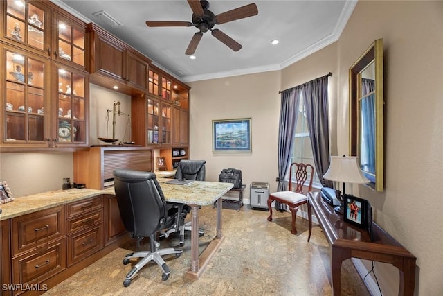 office featuring visible vents, baseboards, ornamental molding, a ceiling fan, and built in study area