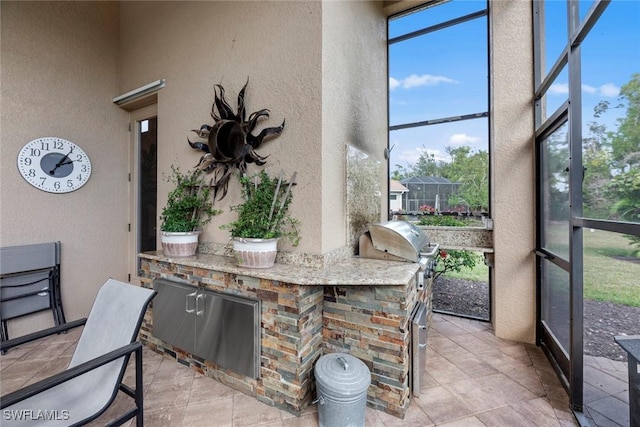 sunroom / solarium featuring area for grilling