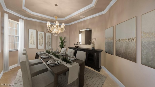 dining space featuring baseboards, a chandelier, crown molding, a tray ceiling, and light tile patterned flooring