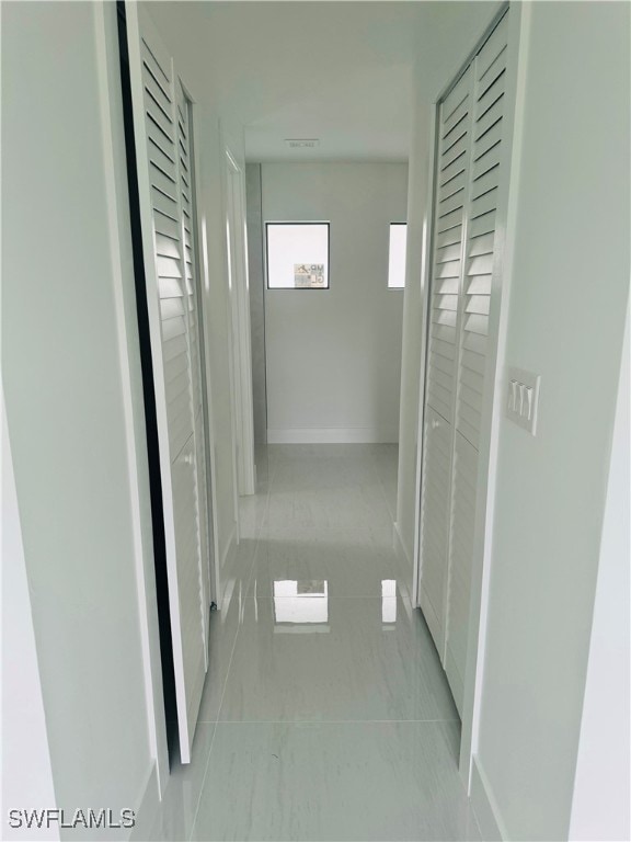 hallway with light tile patterned floors