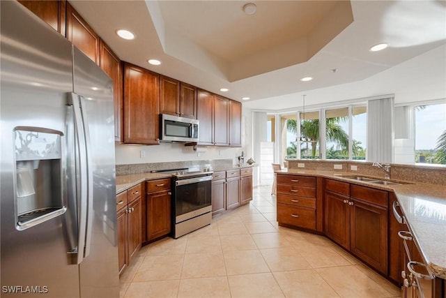 3426 Hancock Bridge Pkwy Unit 407, North Fort Myers, FL 33903 - kitchen with appliances with stainless steel finishes, light stone counters, brown cabinets, and recessed lighting