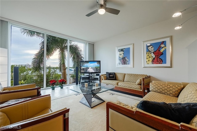 living room with ceiling fan, expansive windows, and carpet