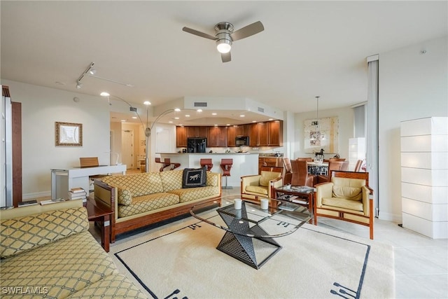 3426 Hancock Bridge Pkwy Unit 407, North Fort Myers, FL 33903 - living area with light tile patterned floors and ceiling fan