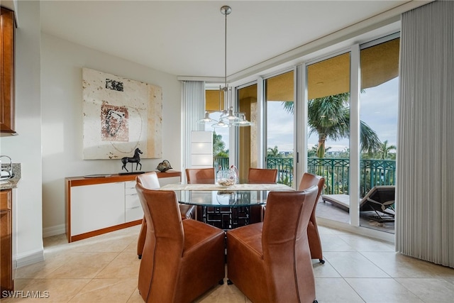 dining room with a notable chandelier and light tile patterned floors