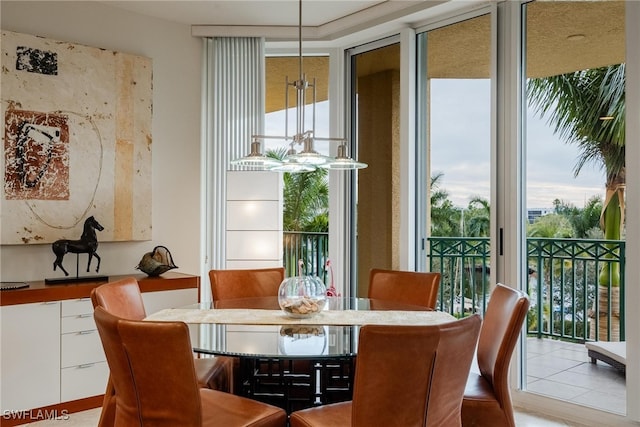 dining space featuring a wall of windows and a healthy amount of sunlight