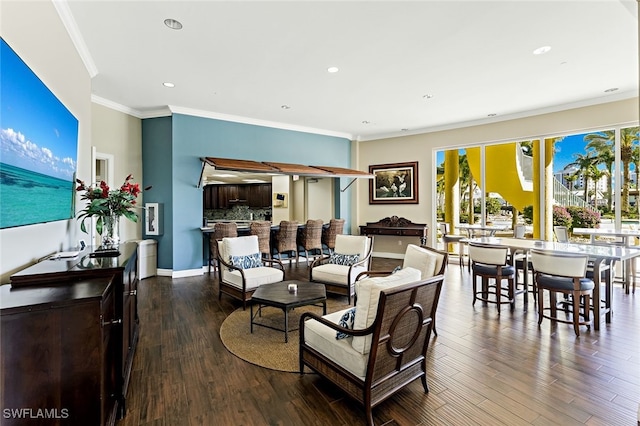 living room with hardwood / wood-style flooring and ornamental molding