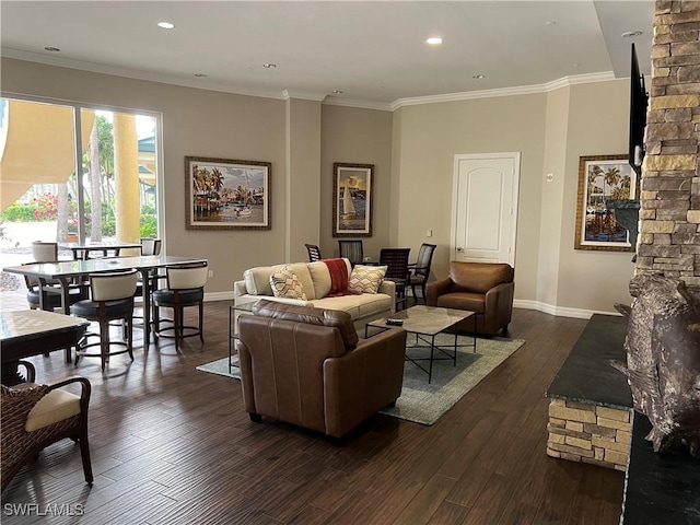 living room with dark hardwood / wood-style flooring and crown molding