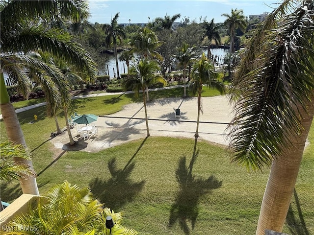 exterior space featuring a water view and a yard