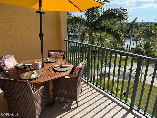 balcony featuring a water view