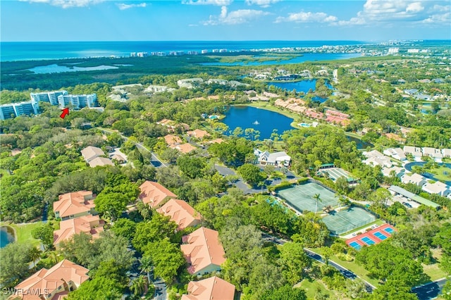 birds eye view of property featuring a water view