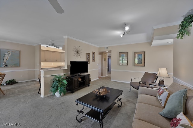 living room with crown molding, light colored carpet, and ceiling fan