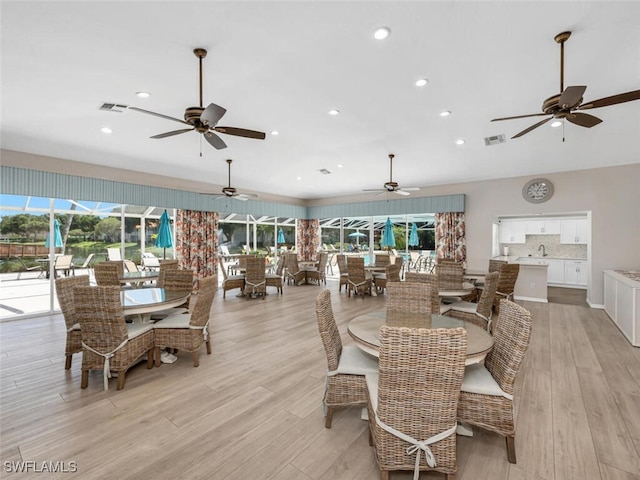 dining area featuring light wood-type flooring