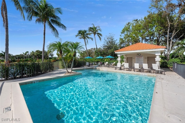 view of pool with an outdoor structure and a patio area