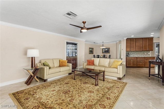 living room with crown molding, light tile patterned floors, and ceiling fan