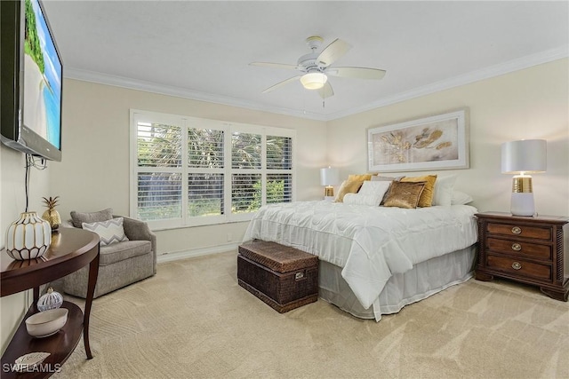 carpeted bedroom featuring ornamental molding and ceiling fan