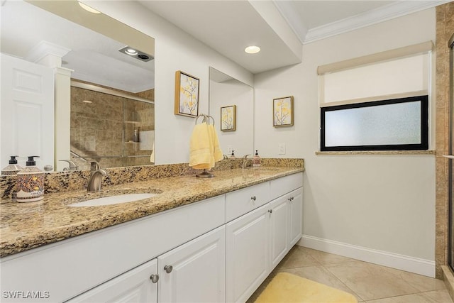 bathroom with vanity, tile patterned floors, ornamental molding, and walk in shower