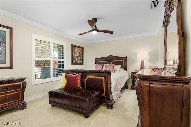 bedroom with crown molding, light colored carpet, and ceiling fan