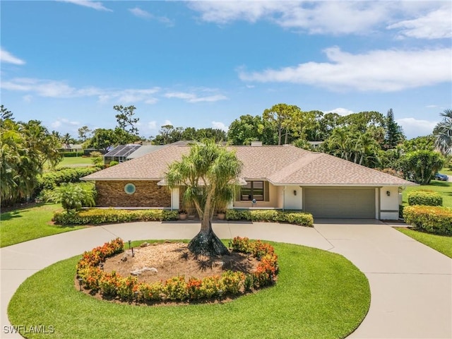 ranch-style house with a garage and a front lawn