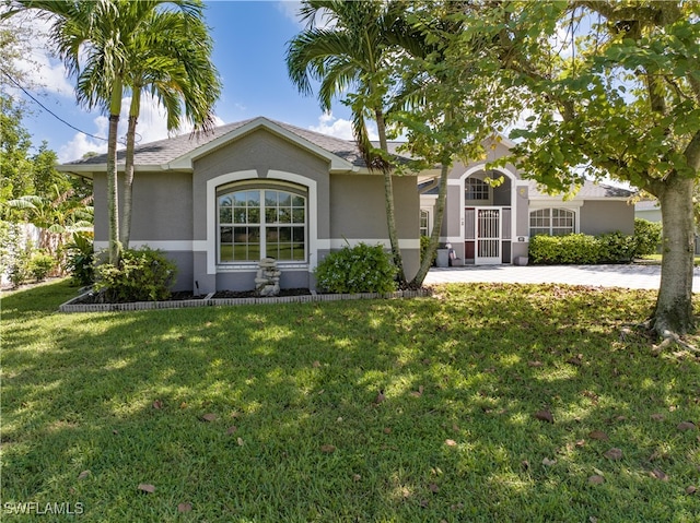 ranch-style house with a front lawn